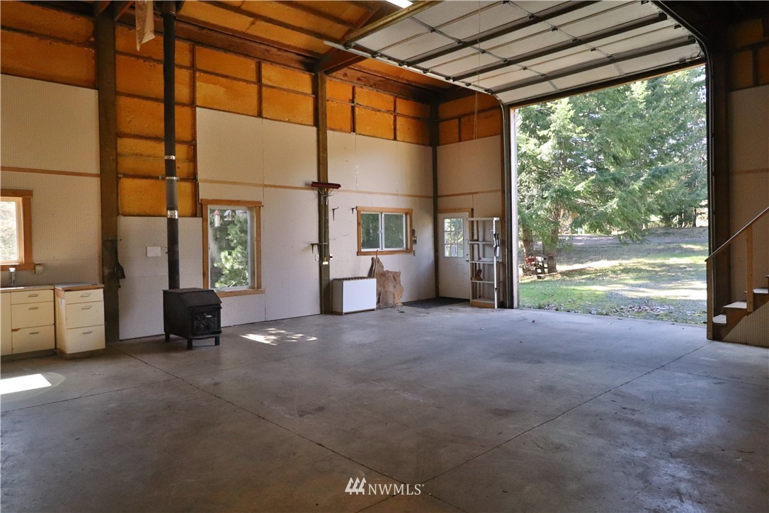 51 Quail Run Road Stevenson, WA 98648 - Photo 27 of 31 a view of an empty room with a fireplace and a floor to ceiling window
