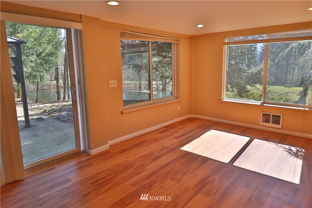 51 Quail Run Road Stevenson, WA 98648 - Photo 5 of 31 a view of an empty room with wooden floor and a window