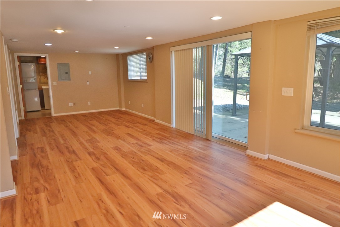 51 Quail Run Road Stevenson, WA 98648 - Photo 7 of 31 a view of an empty room with wooden floor and a window