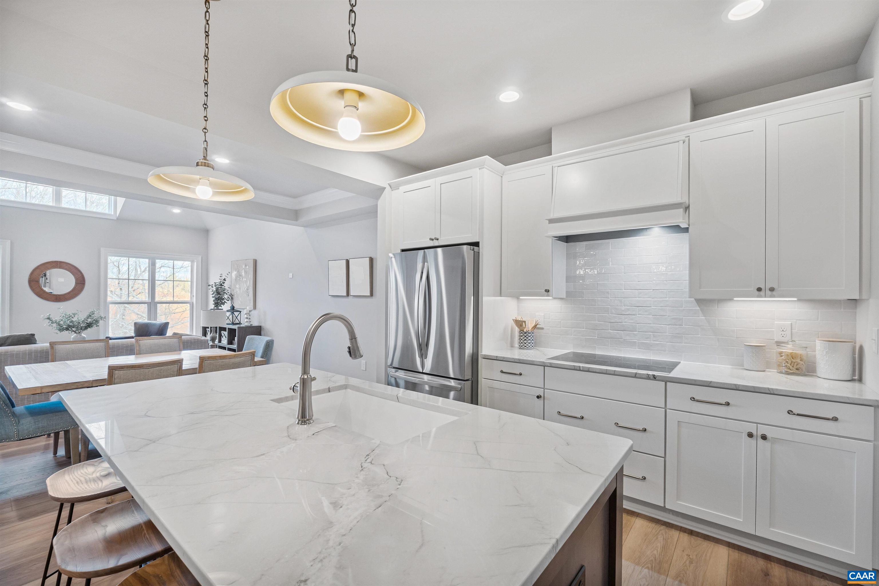 3809 Decerbo Terrace Charlottesville, VA 22901 - Photo 13 of 53 a kitchen with kitchen island a sink a stove and cabinets