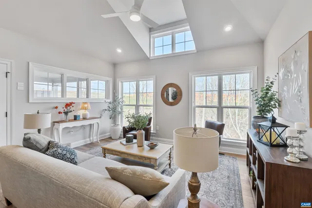 a view of a dining room with furniture and a large window