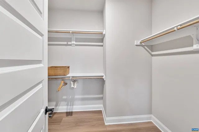 a bathroom with double vanity sinks and a mirror