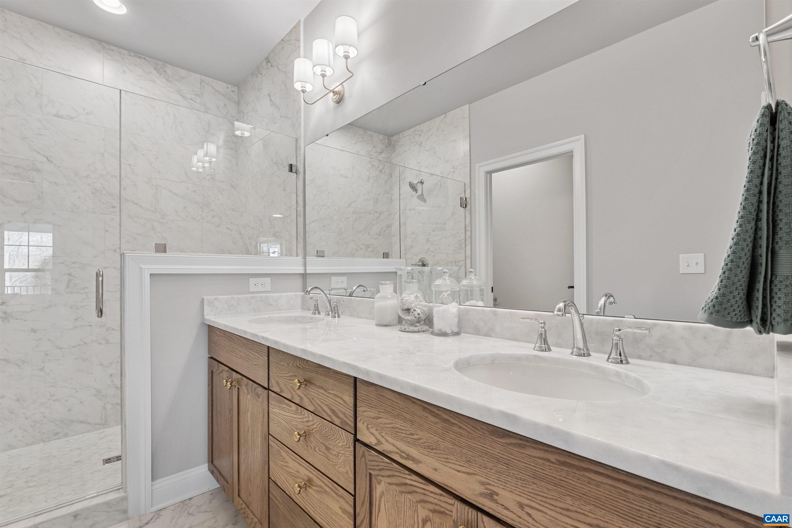3809 Decerbo Terrace Charlottesville, VA 22901 - Photo 25 of 53 a bathroom with double vanity sinks and a mirror