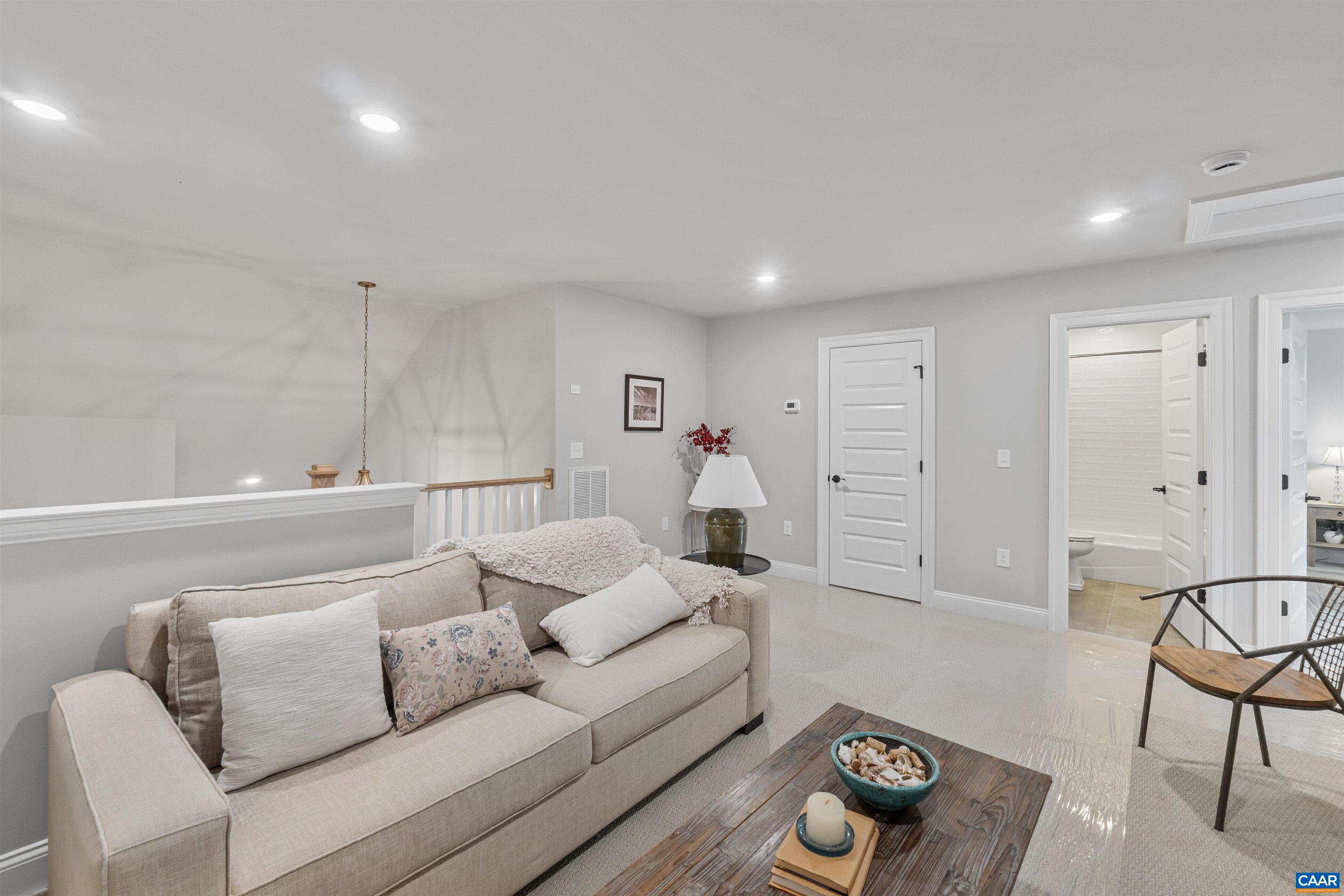 3809 Decerbo Terrace Charlottesville, VA 22901 - Photo 31 of 53 a living room with furniture and a rug