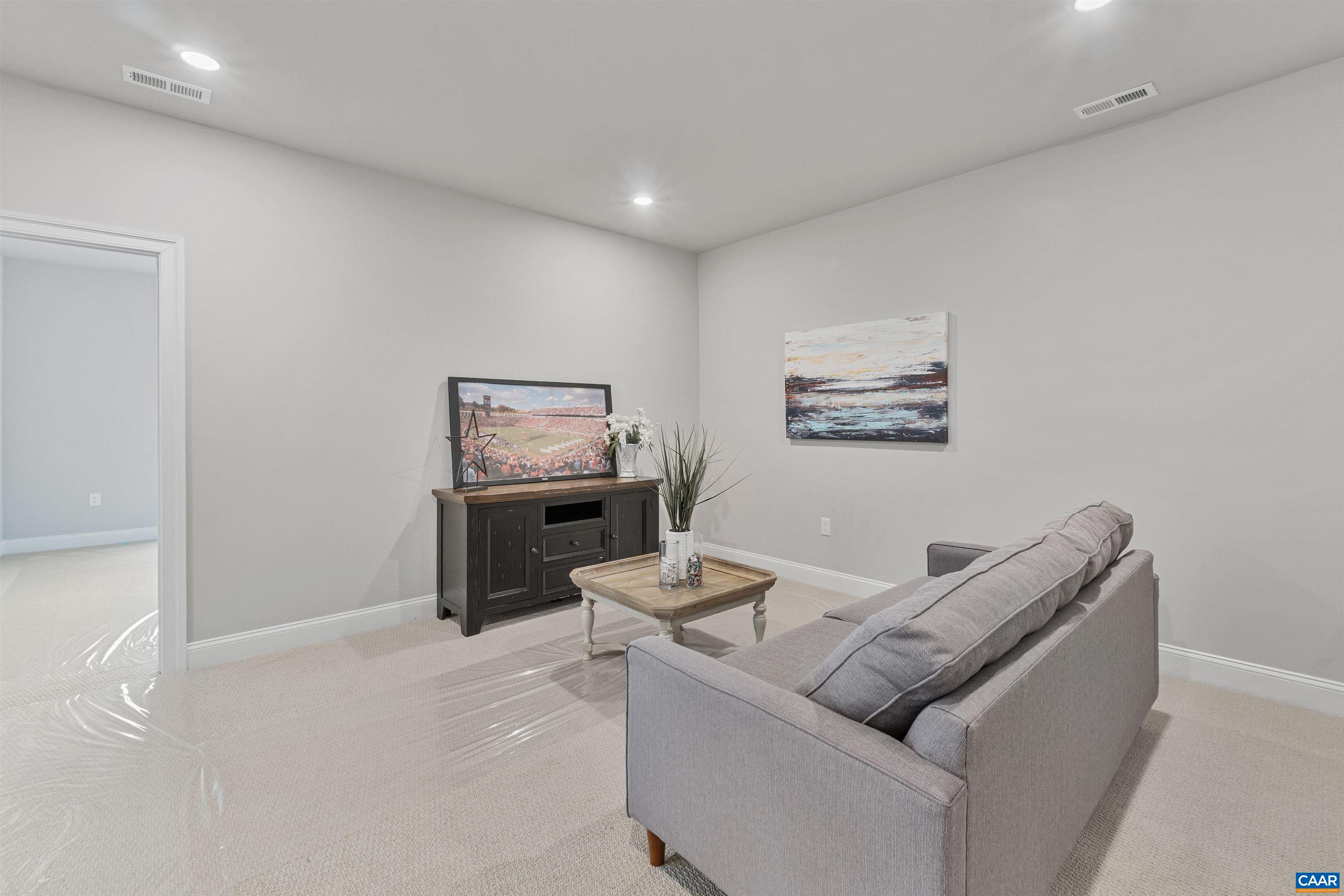 3809 Decerbo Terrace Charlottesville, VA 22901 - Photo 39 of 53 a living room with furniture and a table