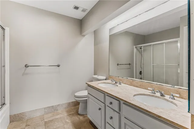 a bathroom with a glass shower door