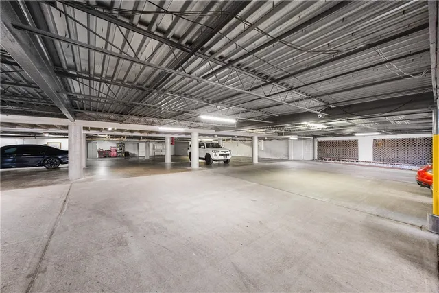 a view of a swimming pool with a patio and a slide