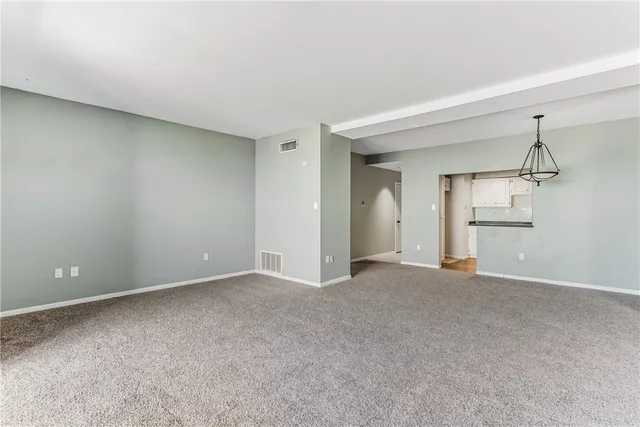 a kitchen with stainless steel appliances granite countertop cabinets and wooden floor