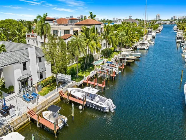 a view of a lake with lawn chairs