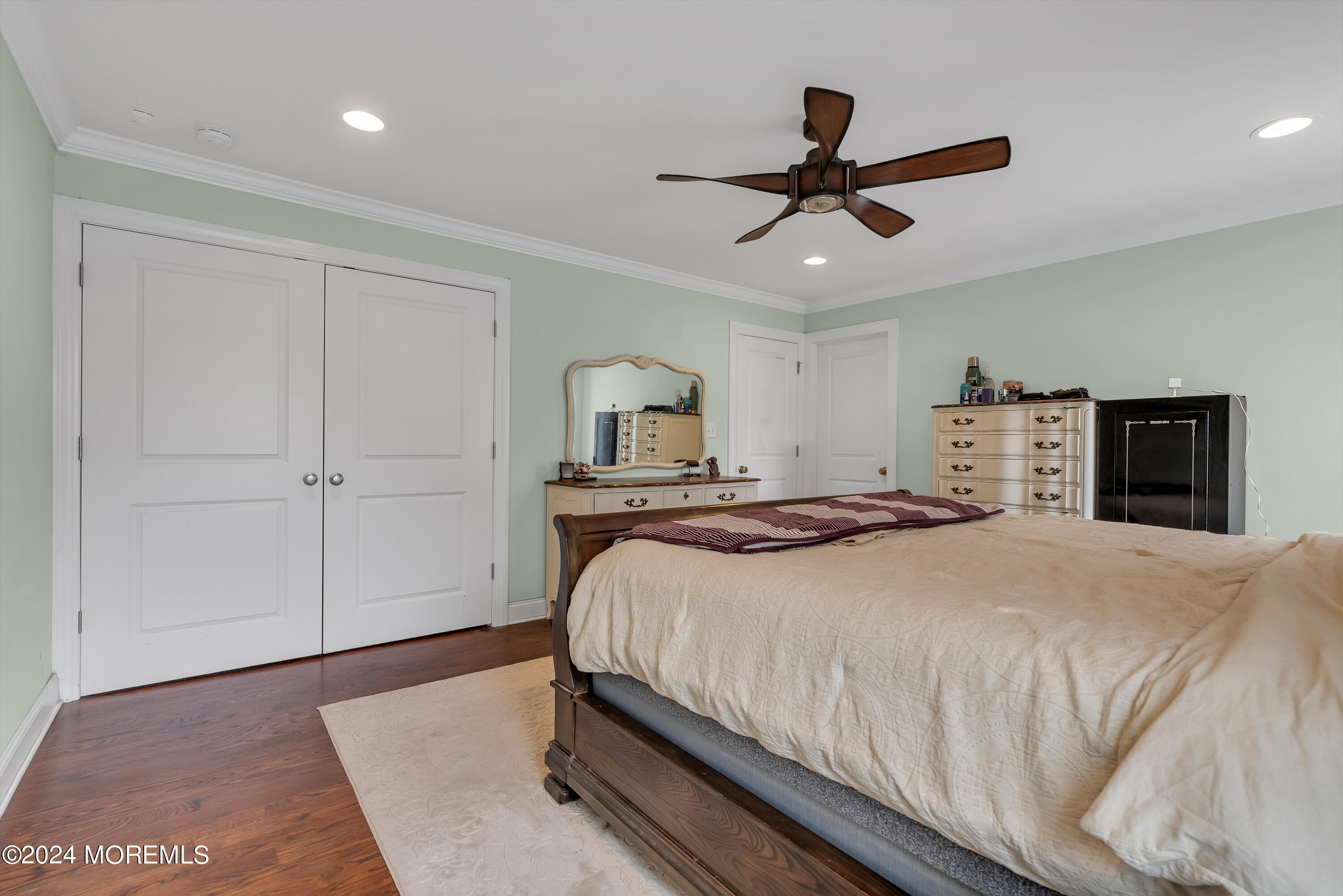 877 Hyson Road Jackson, NJ 08527 - Photo 17 of 35 a bedroom with a large bed and a ceiling fan