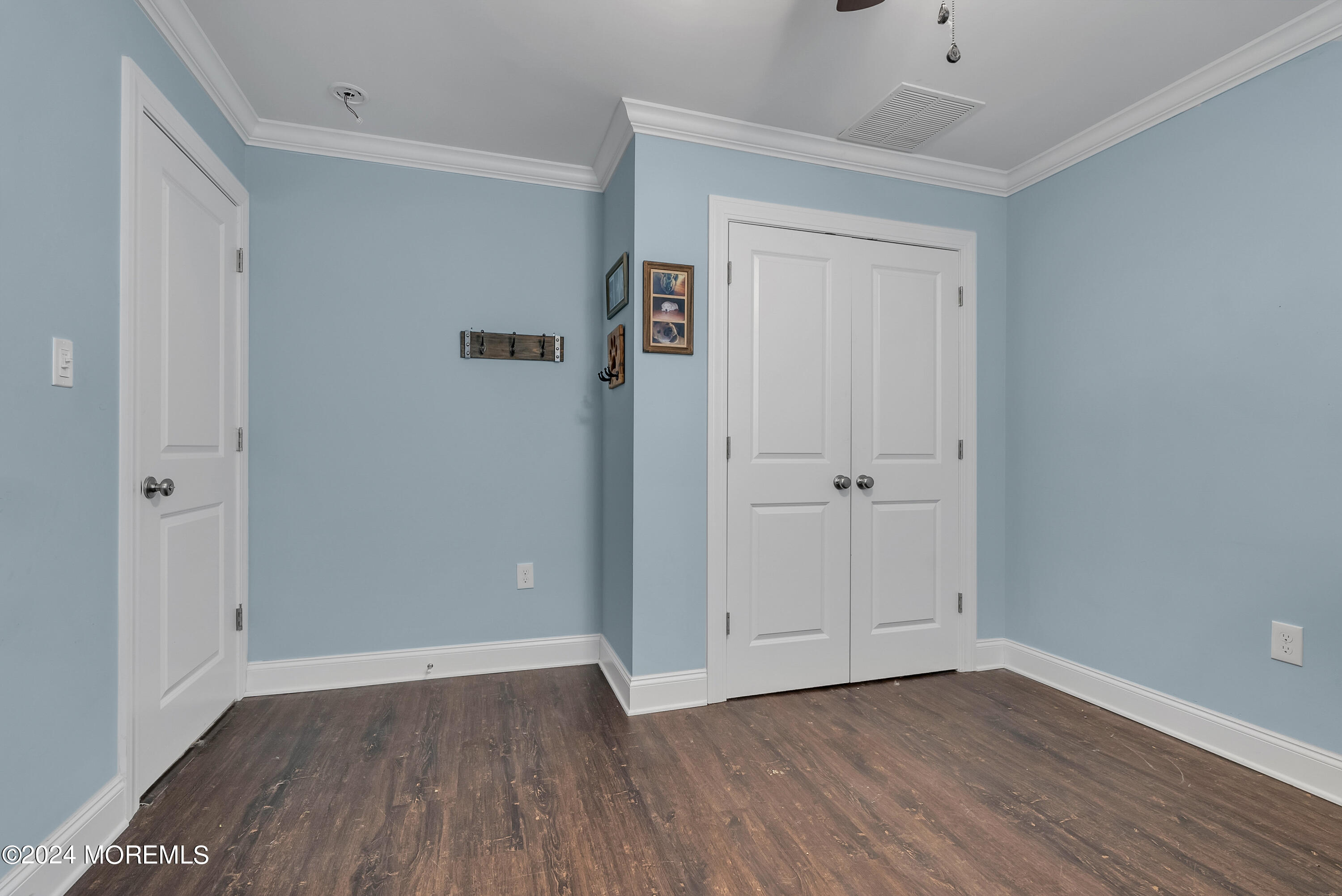 877 Hyson Road Jackson, NJ 08527 - Photo 19 of 35 a view of an empty room with wooden floor