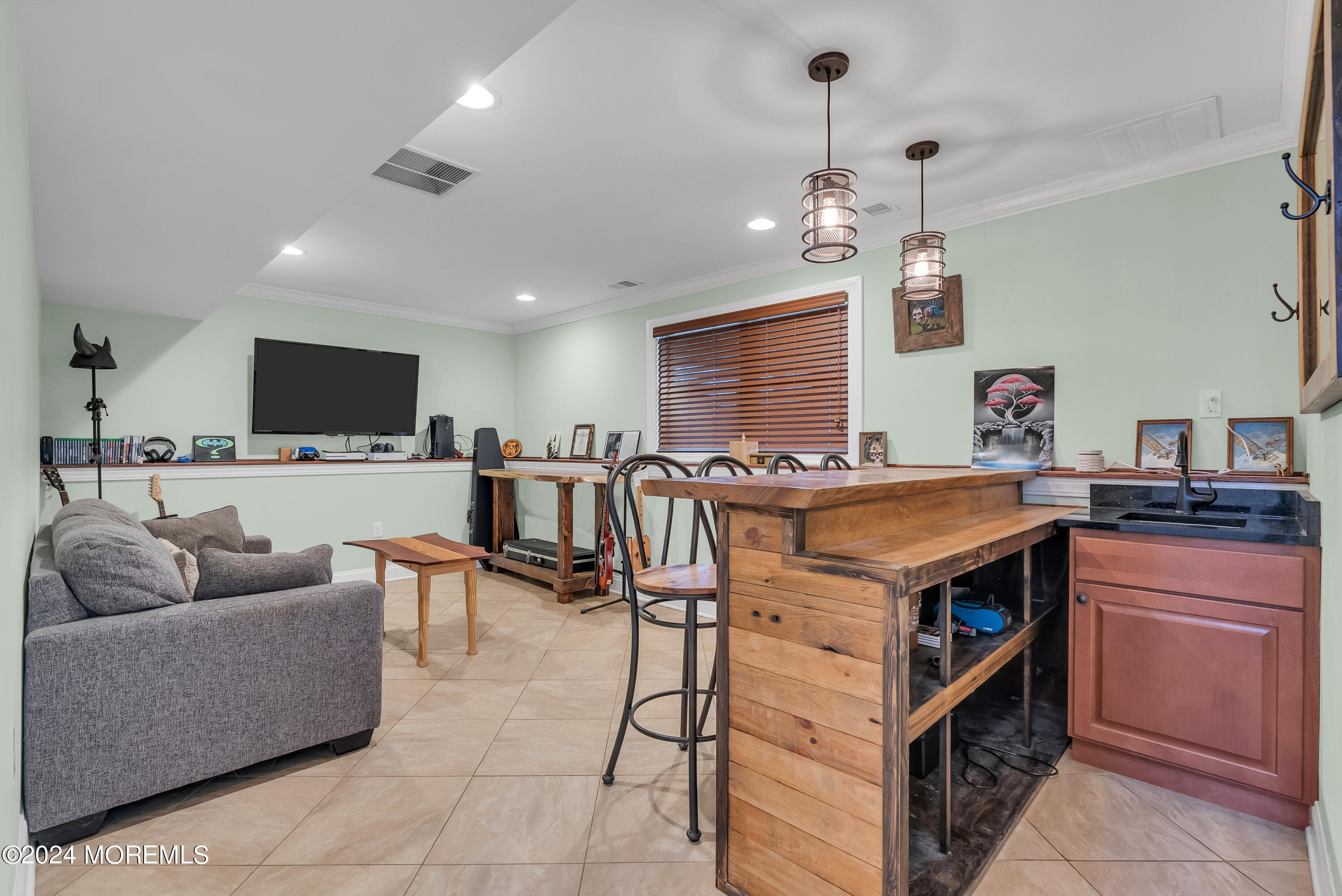 877 Hyson Road Jackson, NJ 08527 - Photo 20 of 35 a living room with stainless steel appliances kitchen island granite countertop a stove a sink a dining table and chairs