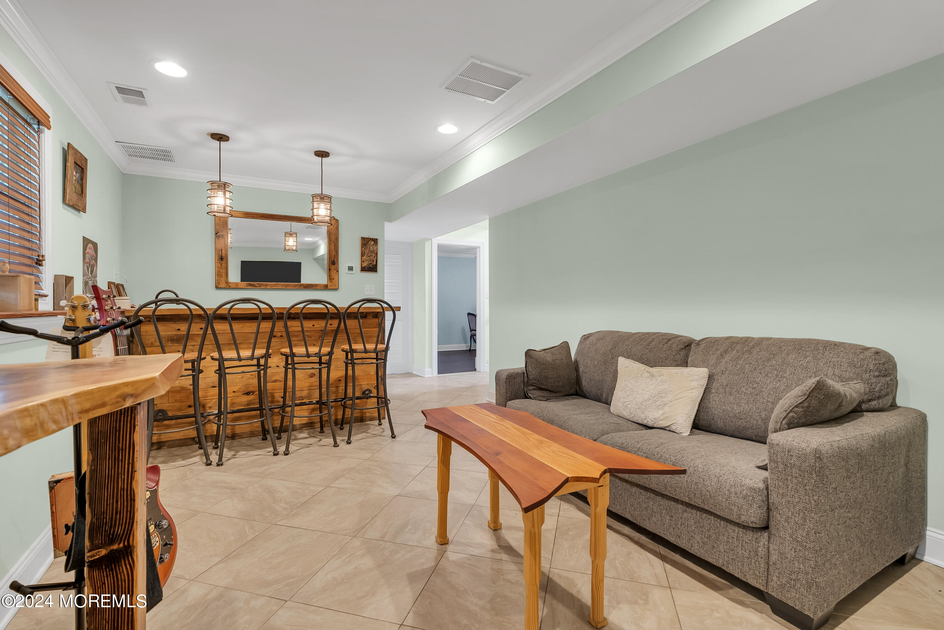 877 Hyson Road Jackson, NJ 08527 - Photo 21 of 35 a living room with furniture a view of dining room and wooden floor