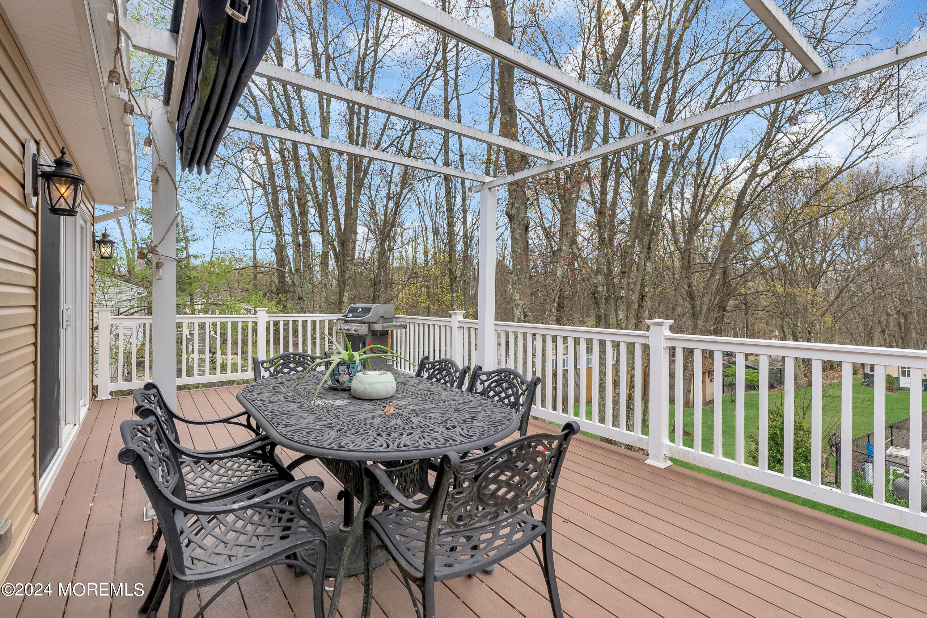 877 Hyson Road Jackson, NJ 08527 - Photo 33 of 35 a view of a chairs and table on the deck