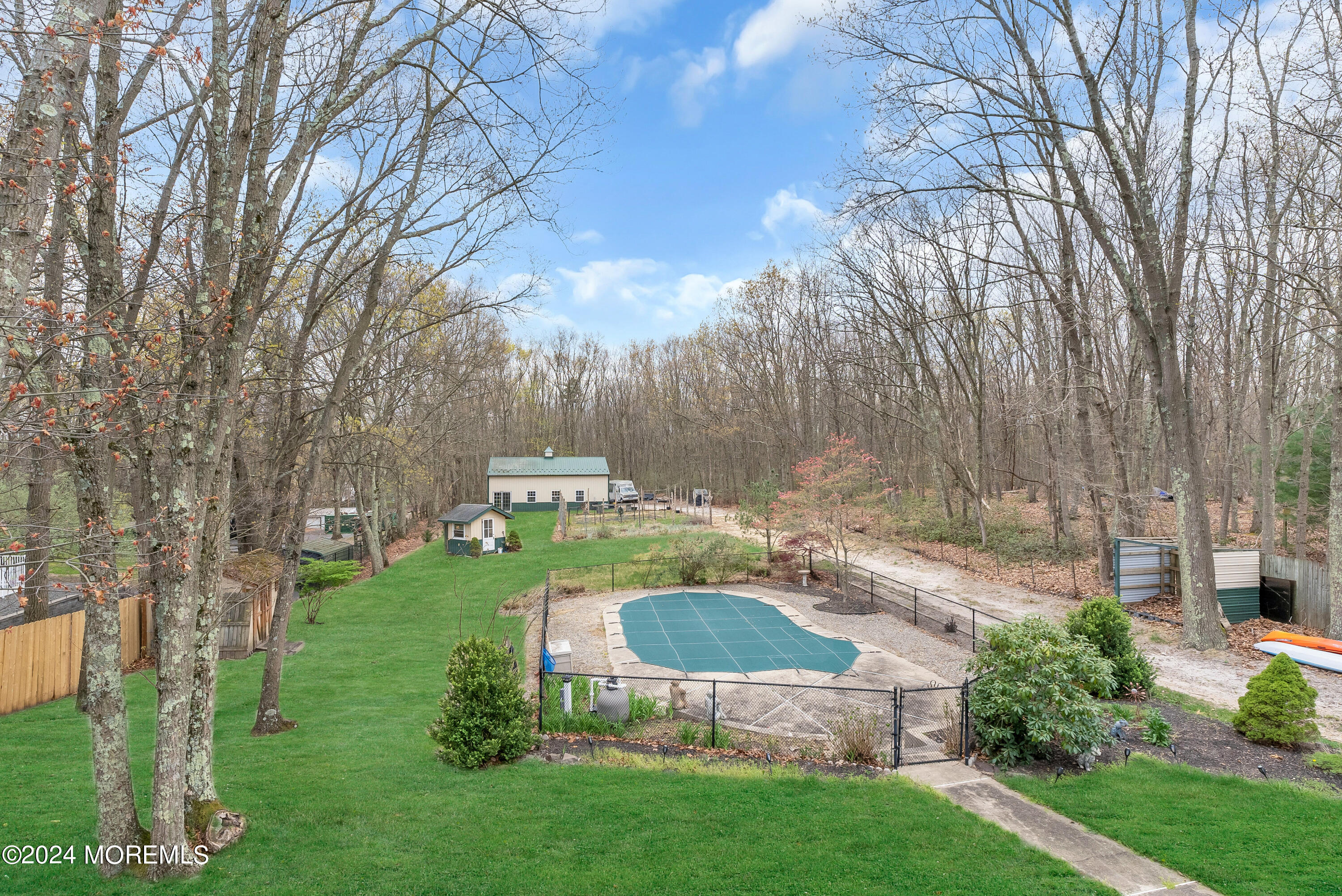 877 Hyson Road Jackson, NJ 08527 - Photo 35 of 35 a view of a garden with a bench in a garden