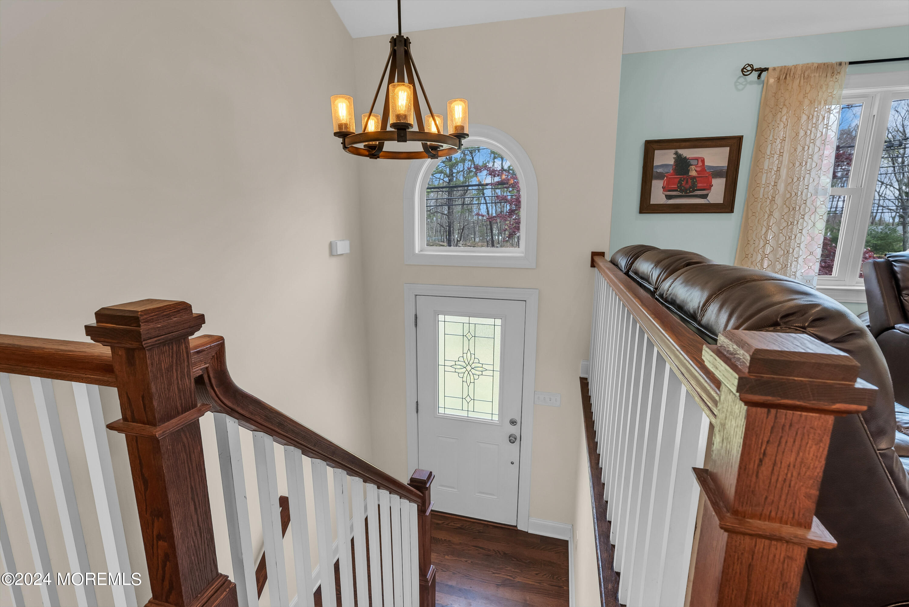 877 Hyson Road Jackson, NJ 08527 - Photo 4 of 35 a view of a hallway with paintings on the wall