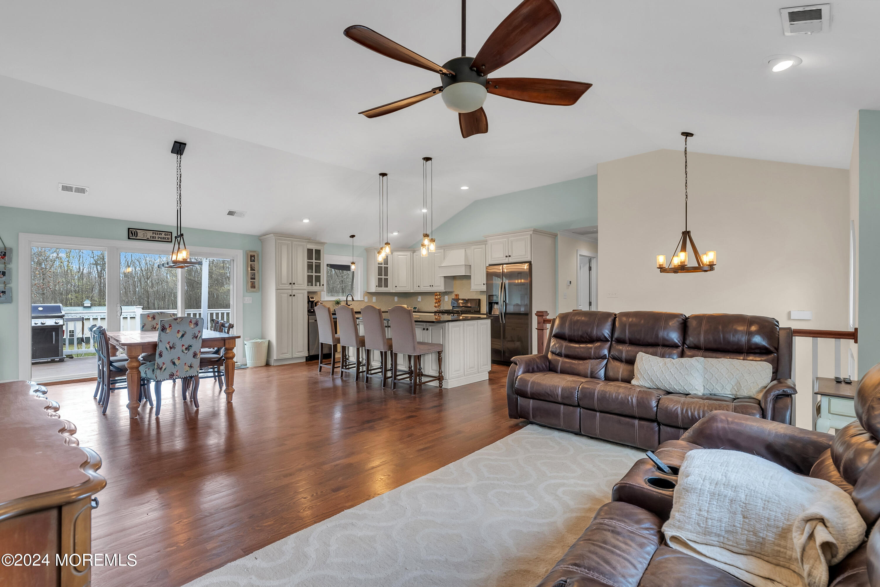 877 Hyson Road Jackson, NJ 08527 - Photo 10 of 35 a living room with furniture kitchen view and a chandelier