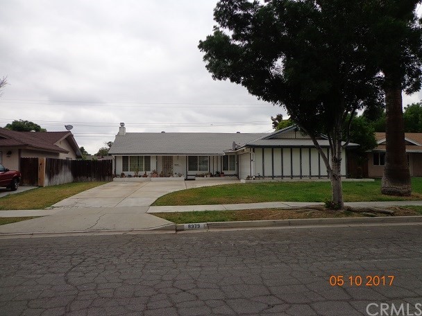 8979 Hope Avenue Riverside, CA 92503 - Photo 1 of 1 a front view of a house with a garden