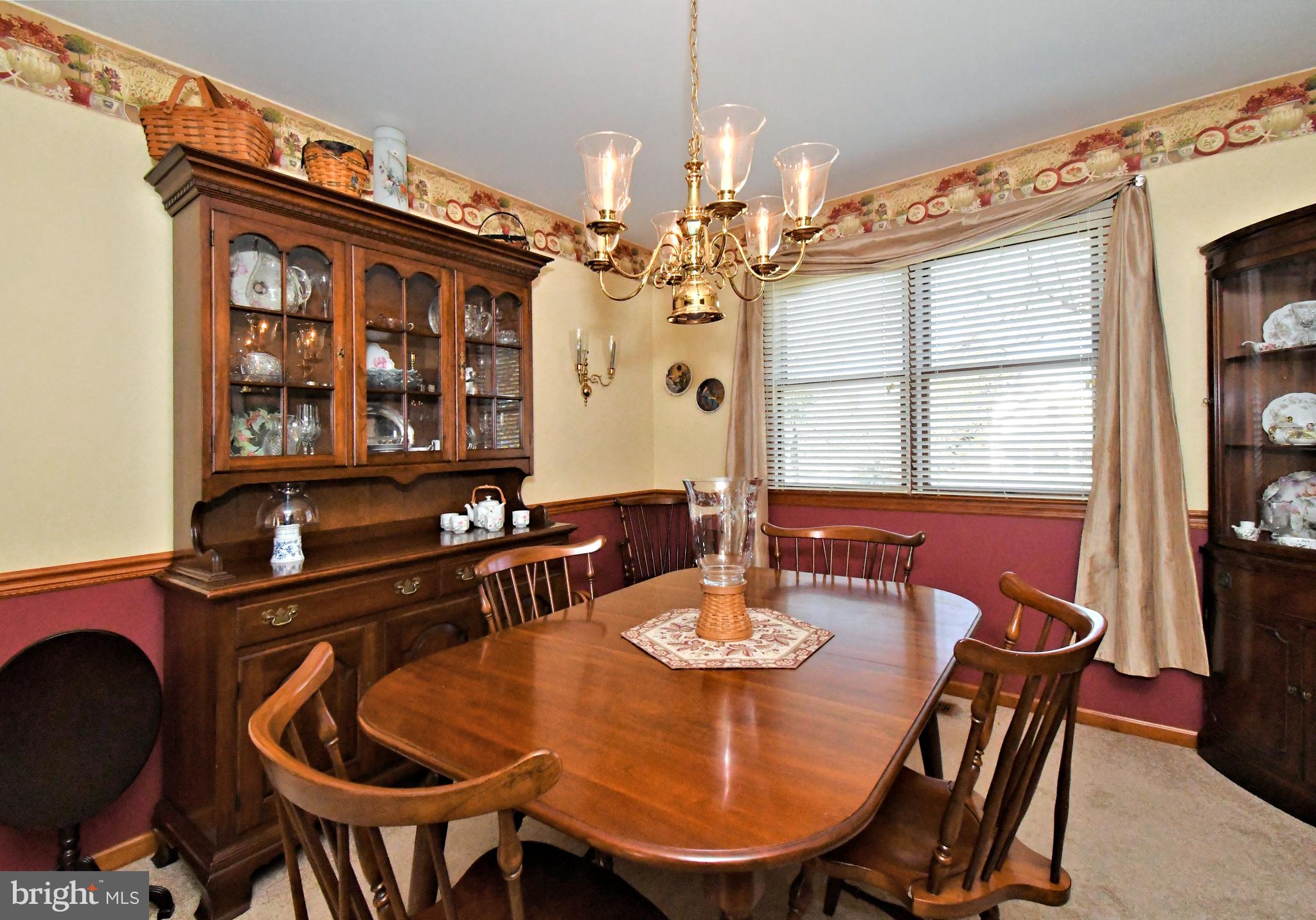 700 Alexander Drive Hatfield, PA 19440 - Photo 11 of 57 a view of a dining room with furniture and chandelier