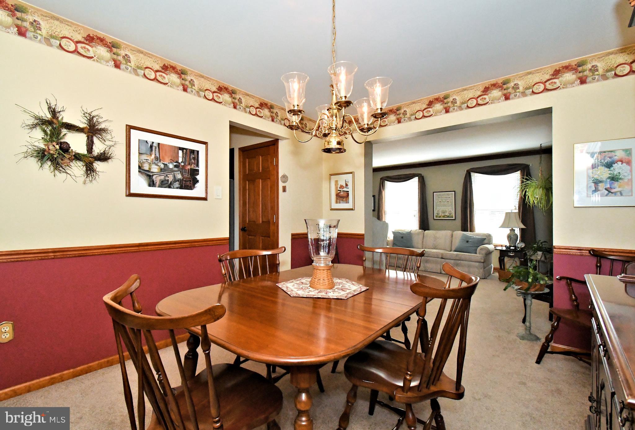 700 Alexander Drive Hatfield, PA 19440 - Photo 12 of 57 a view of a dining room with furniture and a chandelier