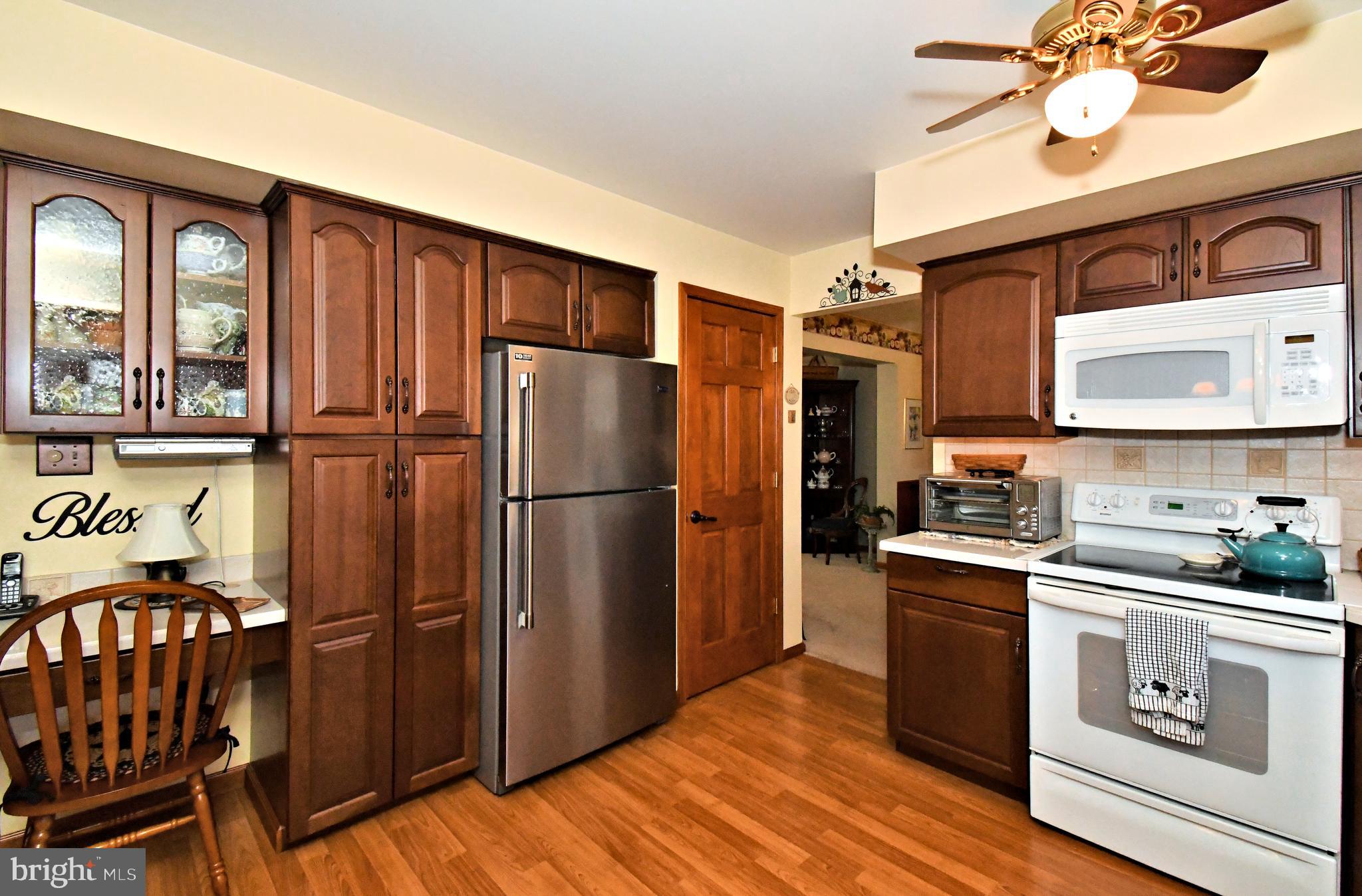 700 Alexander Drive Hatfield, PA 19440 - Photo 18 of 57 a kitchen with stainless steel appliances granite countertop a refrigerator and a stove top oven