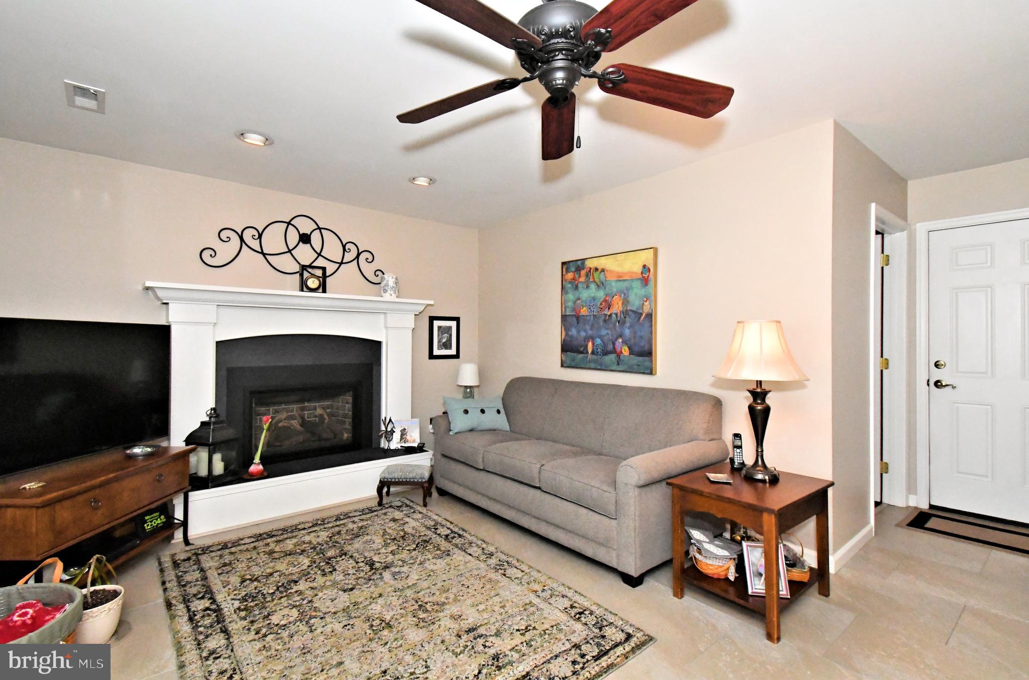 700 Alexander Drive Hatfield, PA 19440 - Photo 23 of 57 a living room with furniture a flat screen tv and a fireplace