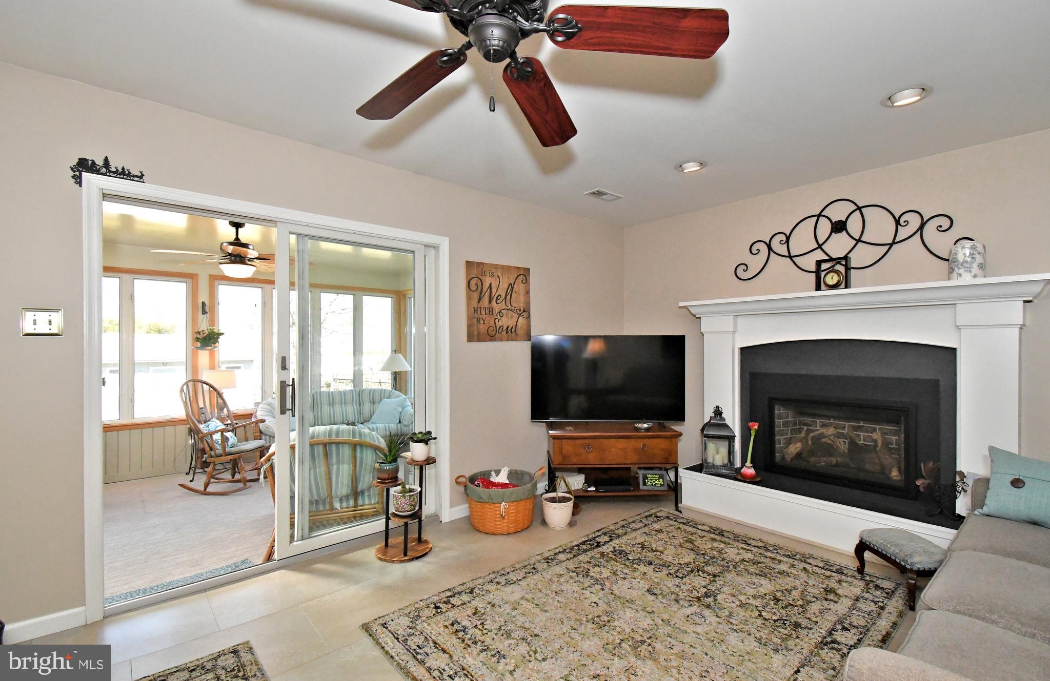 700 Alexander Drive Hatfield, PA 19440 - Photo 24 of 57 a living room with furniture a flat screen tv and a fireplace