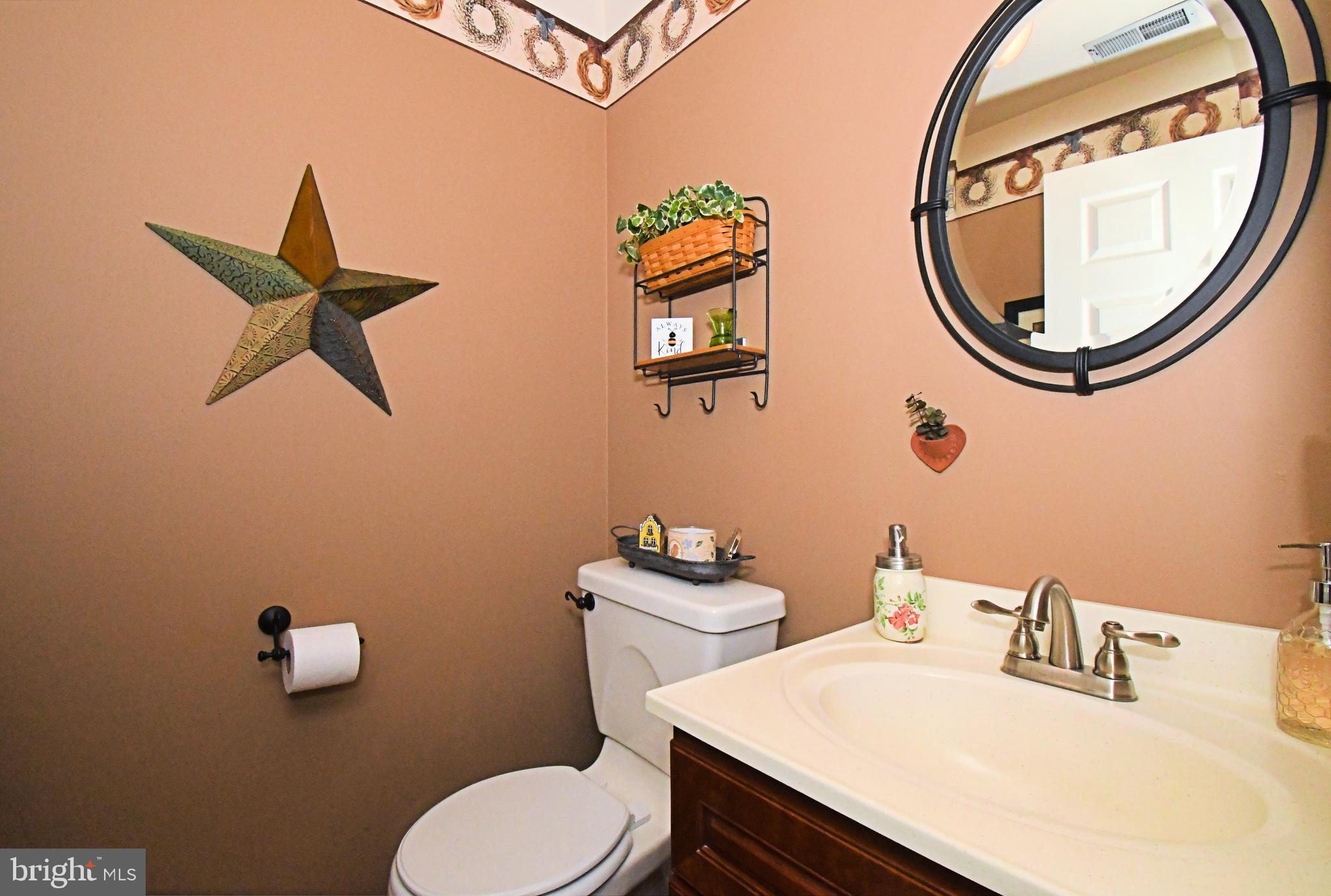 700 Alexander Drive Hatfield, PA 19440 - Photo 27 of 57 a bathroom with a sink mirror and toilet
