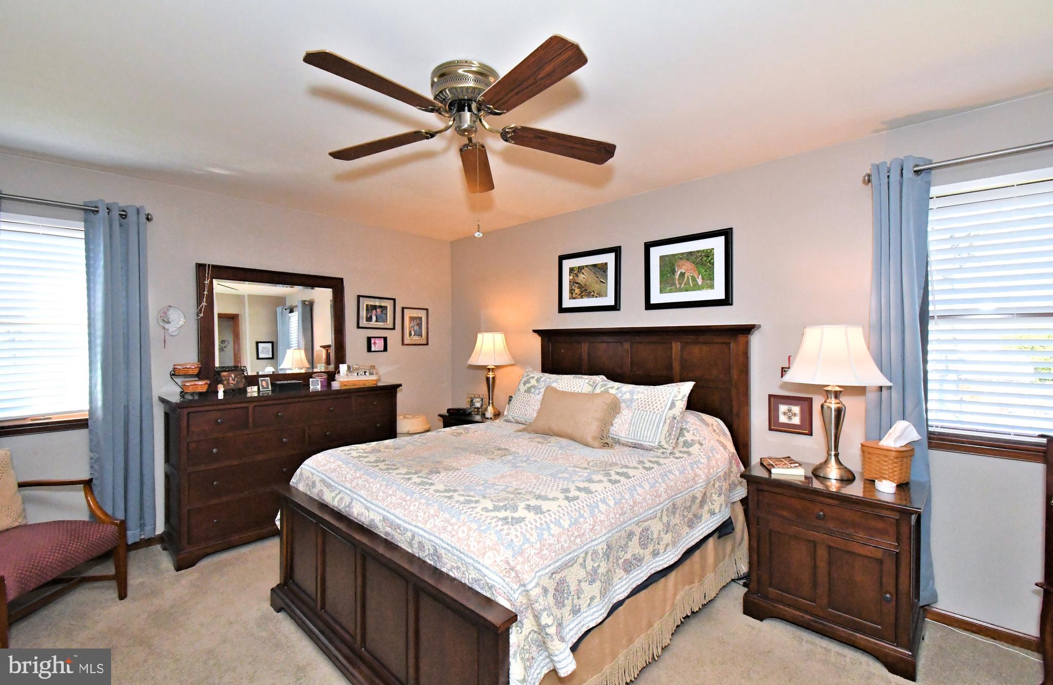 700 Alexander Drive Hatfield, PA 19440 - Photo 30 of 57 a bedroom with a large bed and a chandelier