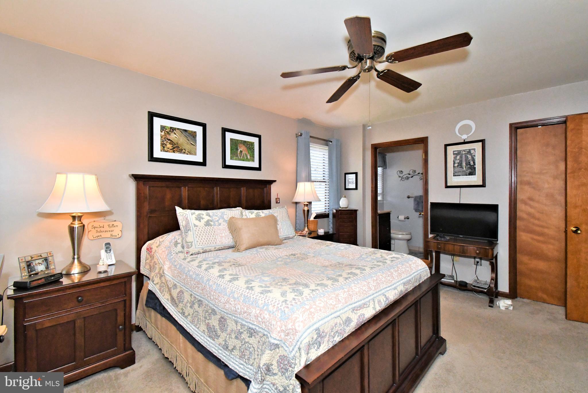 700 Alexander Drive Hatfield, PA 19440 - Photo 31 of 57 a bedroom with a bed and a lamp on table