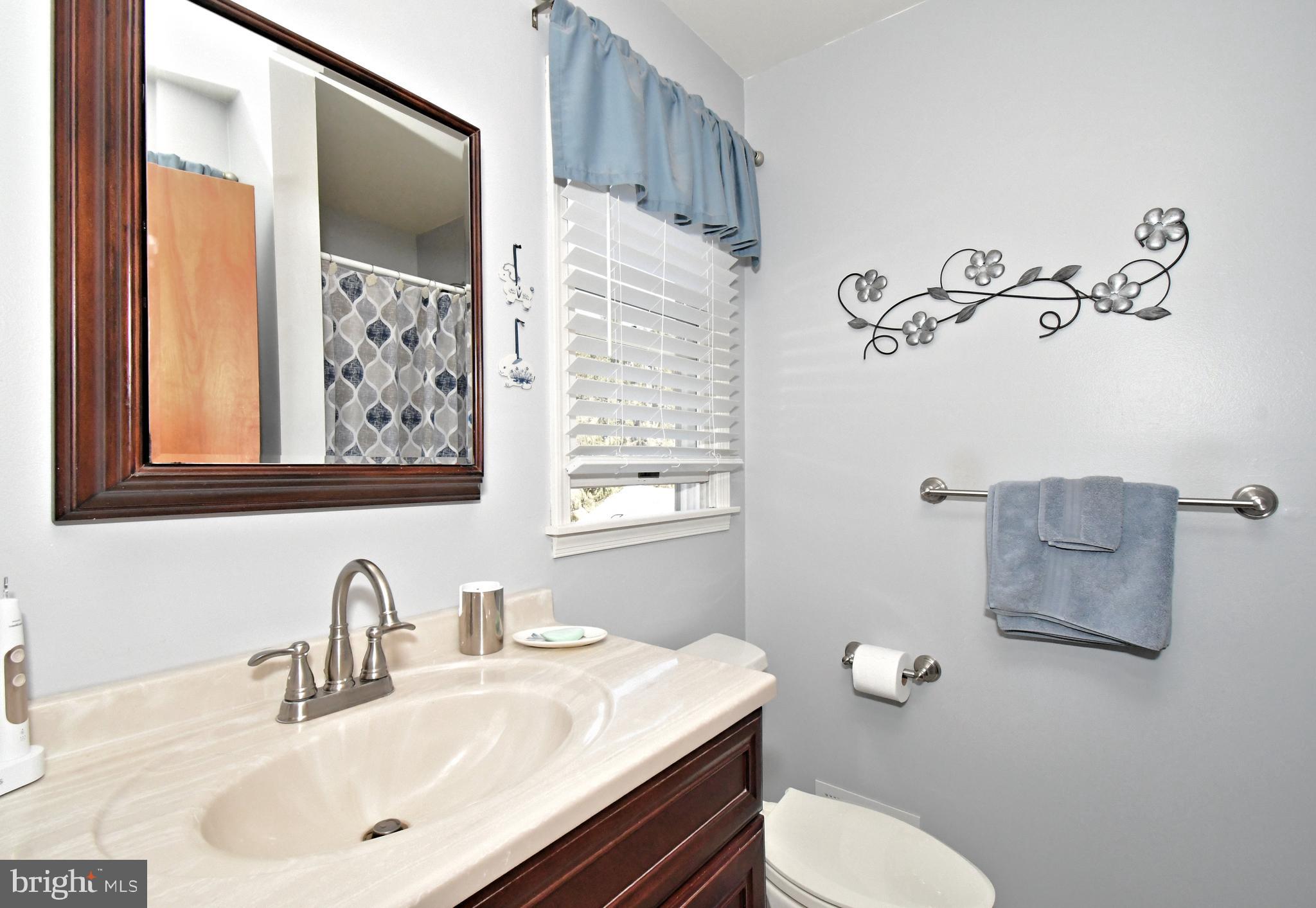 700 Alexander Drive Hatfield, PA 19440 - Photo 33 of 57 a bathroom with a sink mirror vanity and toilet