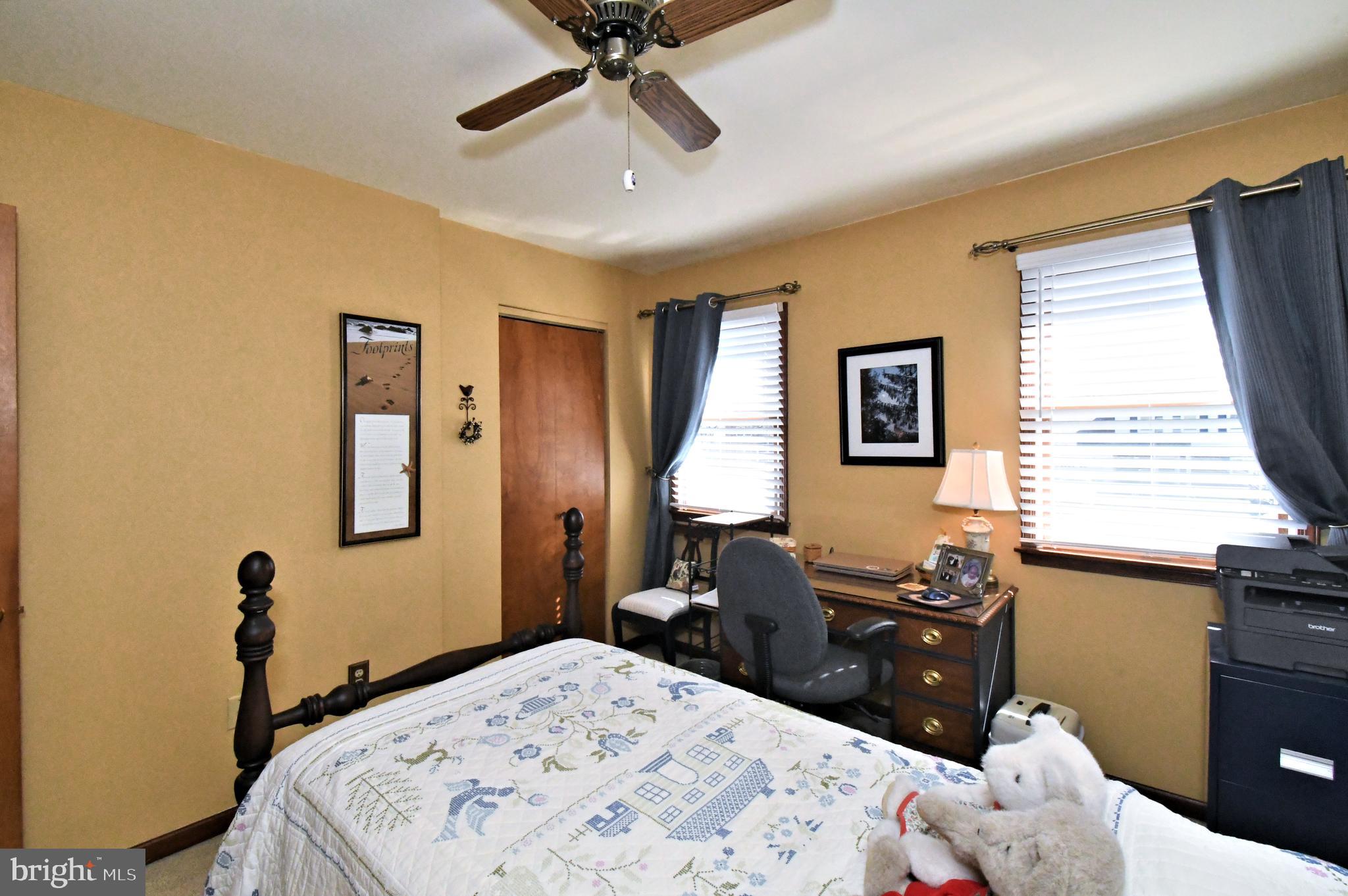 700 Alexander Drive Hatfield, PA 19440 - Photo 35 of 57 a bed room with a bed and a chandelier