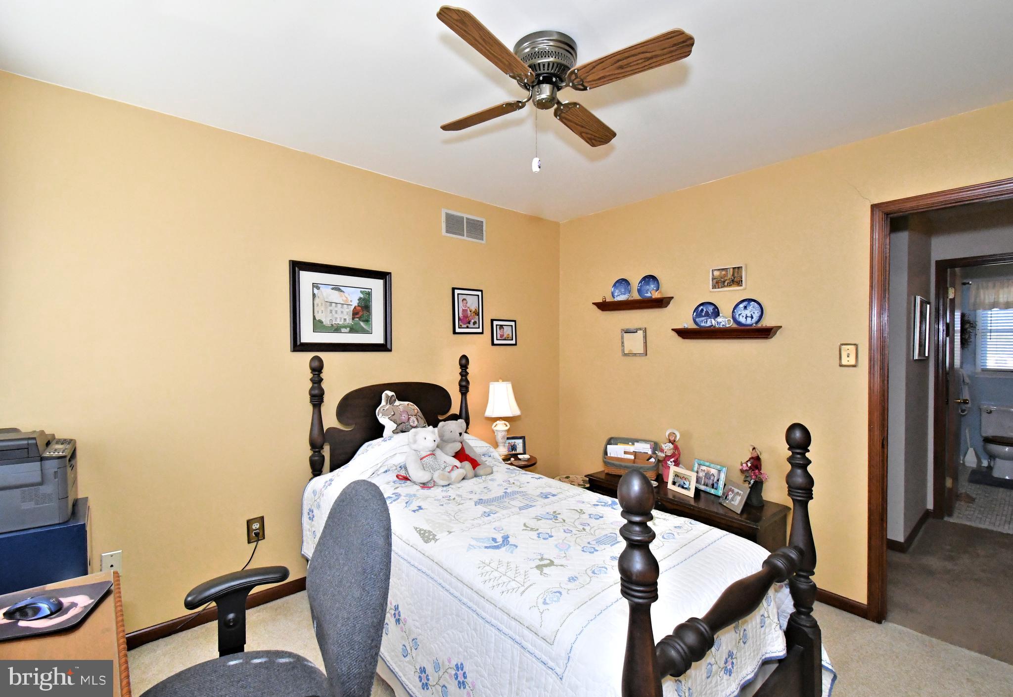 700 Alexander Drive Hatfield, PA 19440 - Photo 36 of 57 a bedroom with a bed a desk and chair