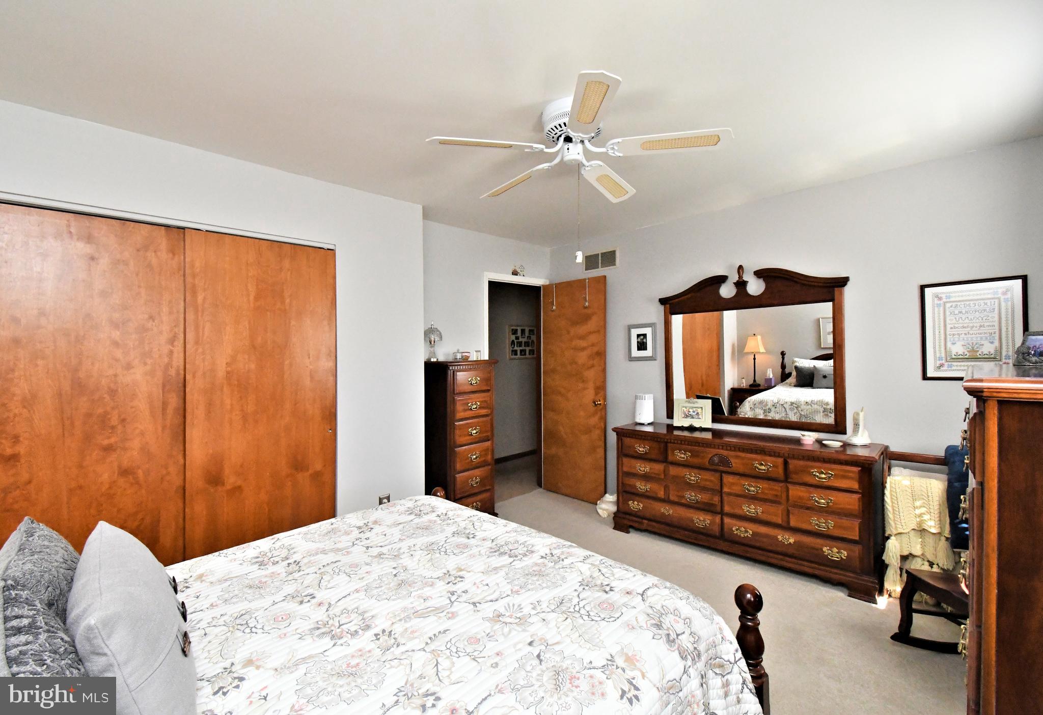 700 Alexander Drive Hatfield, PA 19440 - Photo 38 of 57 a bedroom with a bed and a chandelier