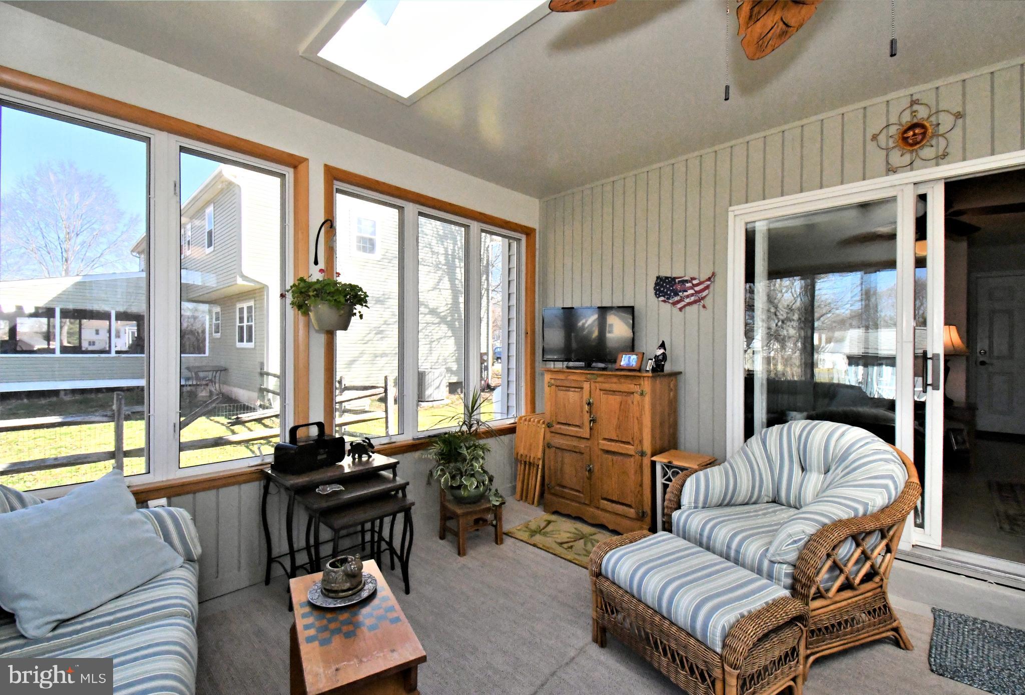 700 Alexander Drive Hatfield, PA 19440 - Photo 43 of 57 a living room with furniture and a floor to ceiling window