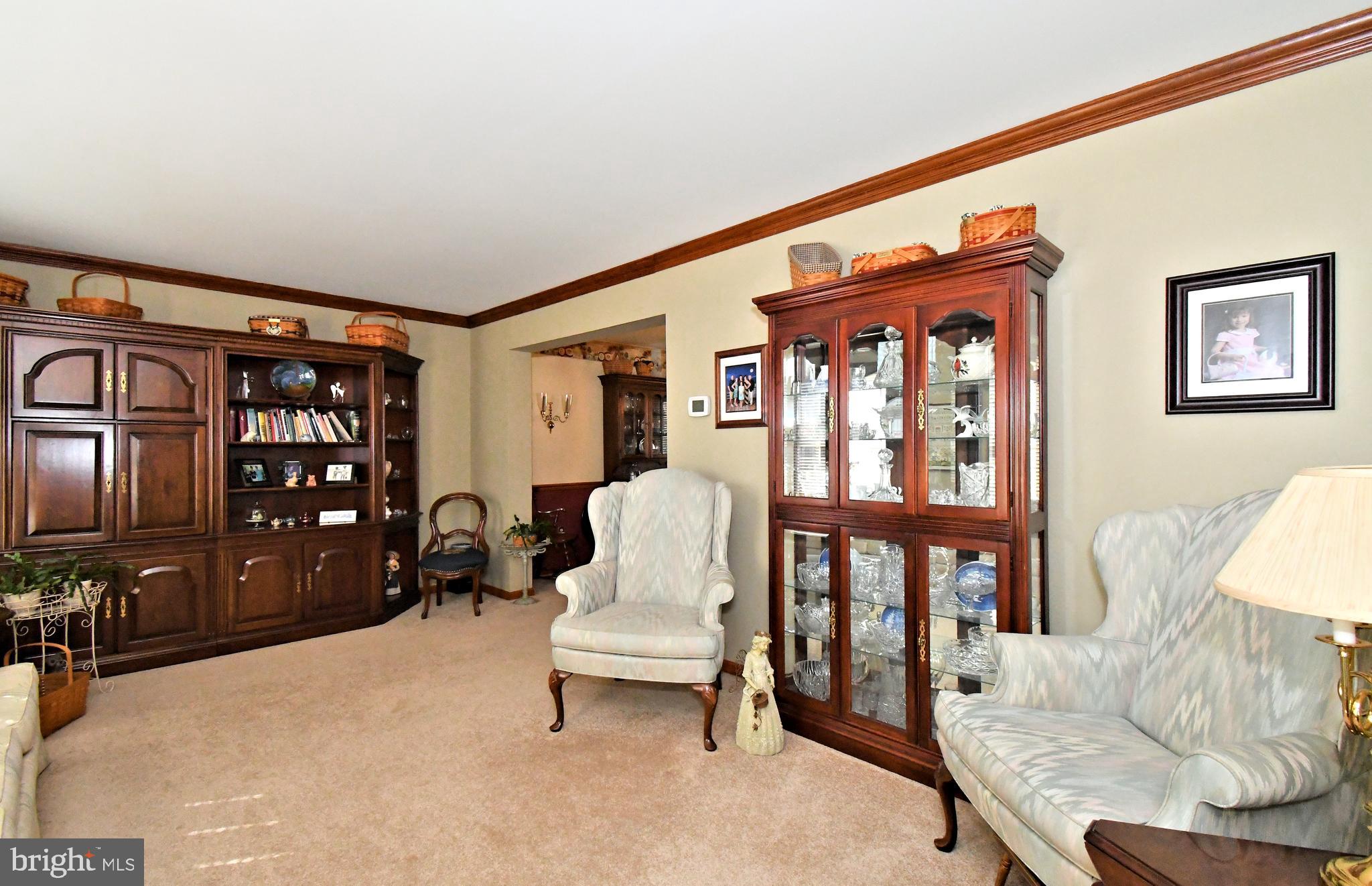 700 Alexander Drive Hatfield, PA 19440 - Photo 7 of 57 a living room with furniture a rug and a window