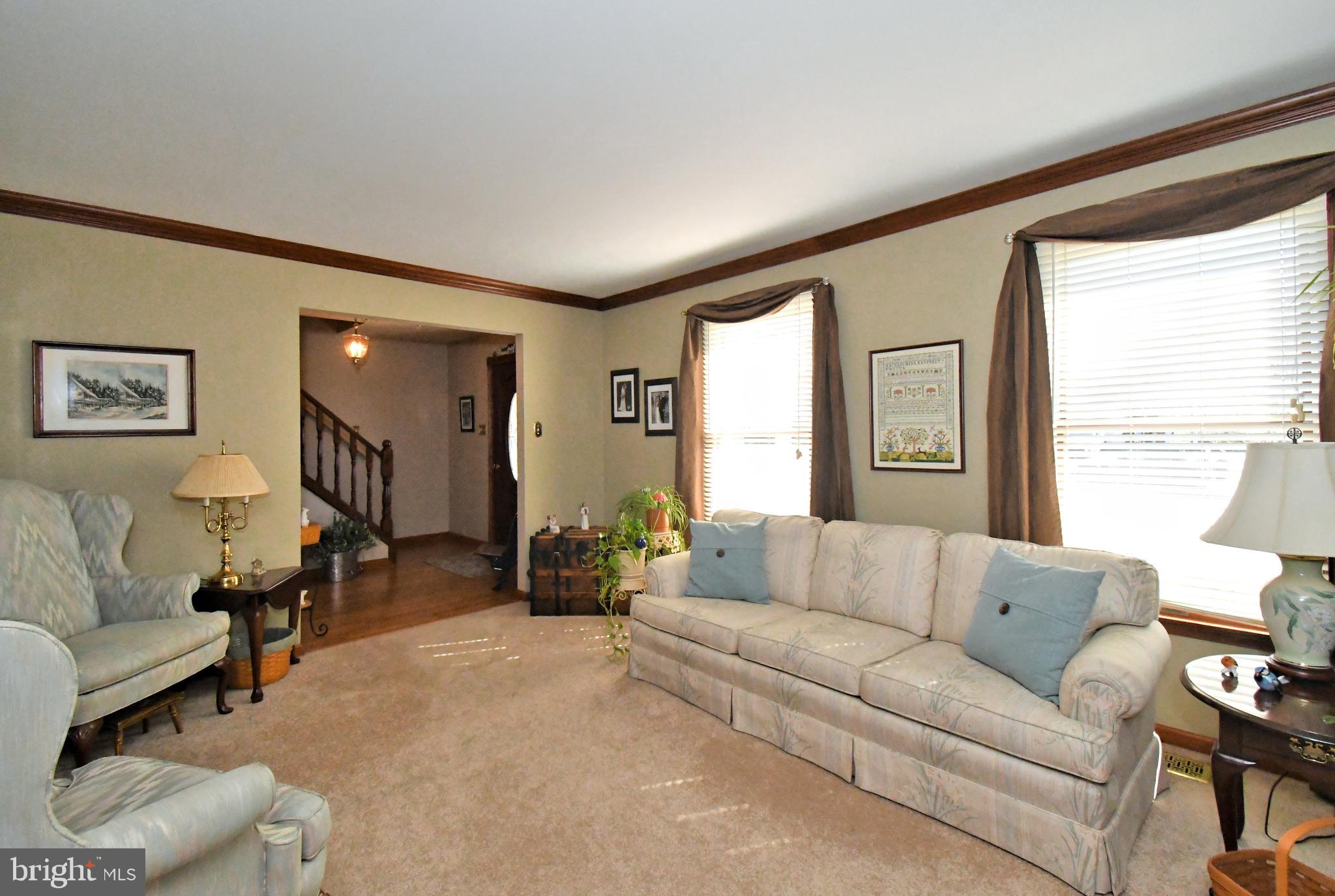 700 Alexander Drive Hatfield, PA 19440 - Photo 9 of 57 a living room with furniture and a large window