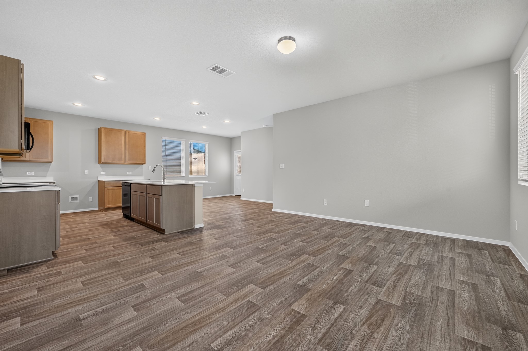 2704 Towy Road Manor, TX 78653 - Photo 28 of 36 Clean lines and durable wood-look flooring define this versatile, open-concept living space.