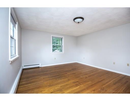 4 Donna Road Andover, MA 01810 - Photo 14 of 19 a view of an empty room with a window and wooden floor