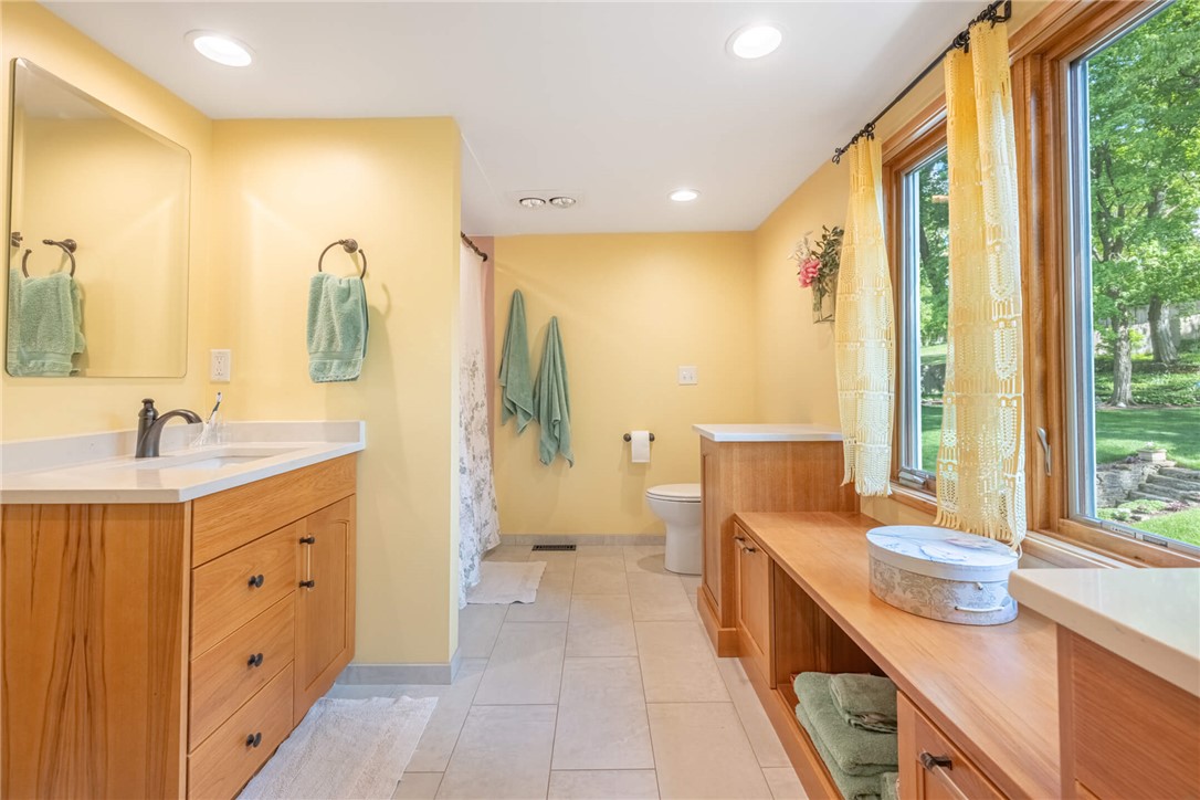 156 West Hadley Road Dayton, OH 45419 - Photo 28 of 71 This spacious bathroom offers abundant natural light and a serene view of the surrounding landscape.