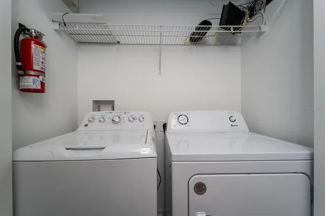 a utility room with dryer and washer