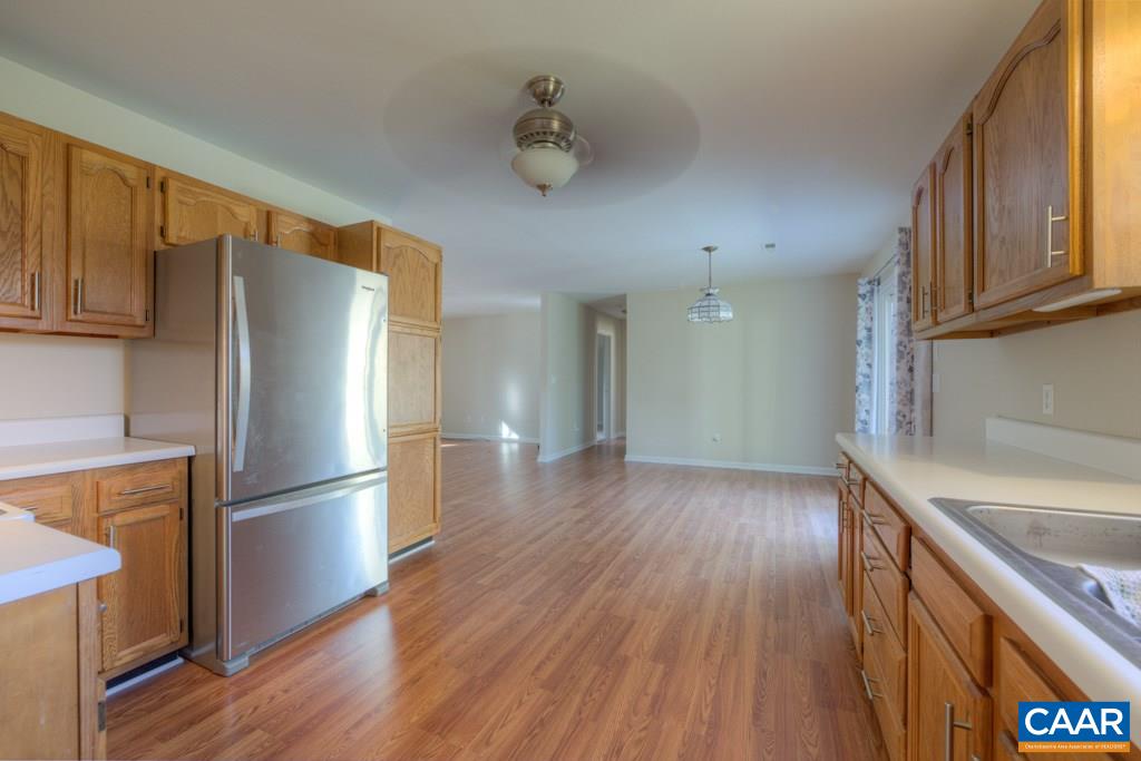 296 Morning Glory Road Ruckersville, VA 22968 - Photo 13 of 27 a kitchen with stainless steel appliances granite countertop a refrigerator and a sink