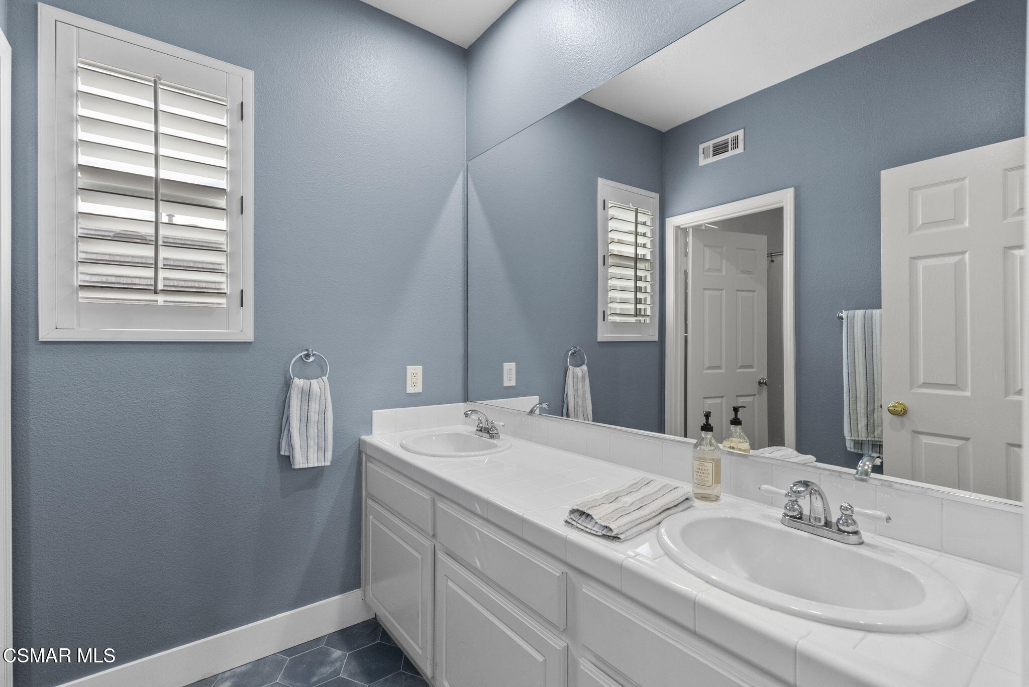 2648 Fallen Leaf Court Simi Valley, CA 93063 - Photo 27 of 42 a bathroom with a sink and a mirror