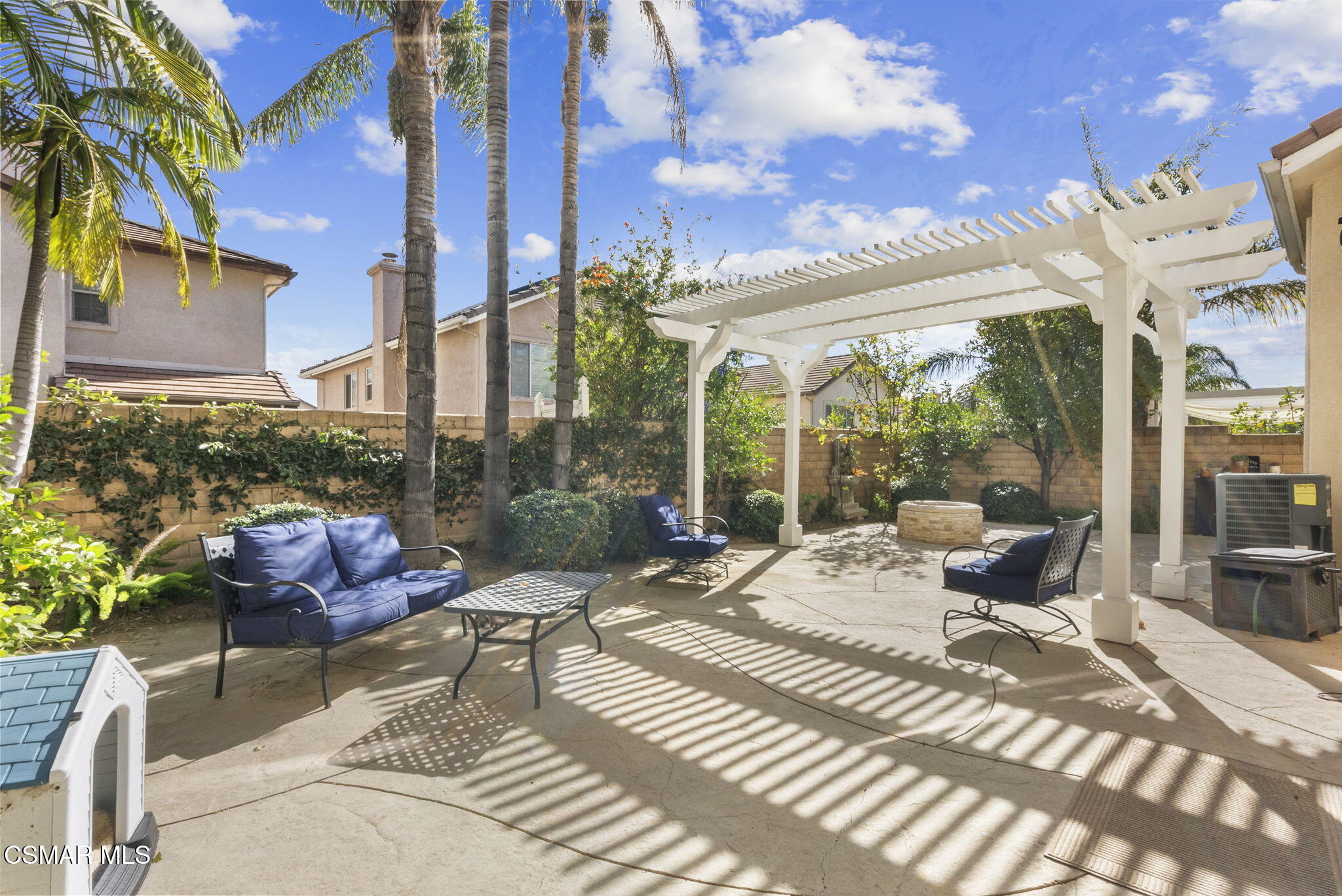 2648 Fallen Leaf Court Simi Valley, CA 93063 - Photo 36 of 42 a view of a patio with table and chairs potted plants with wooden floor and city view