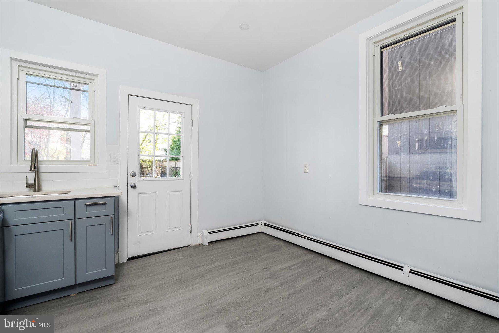 10 Lytle Street, Unit 2 Princeton, NJ 08542 - Photo 11 of 16 an empty room with a window and wooden floor