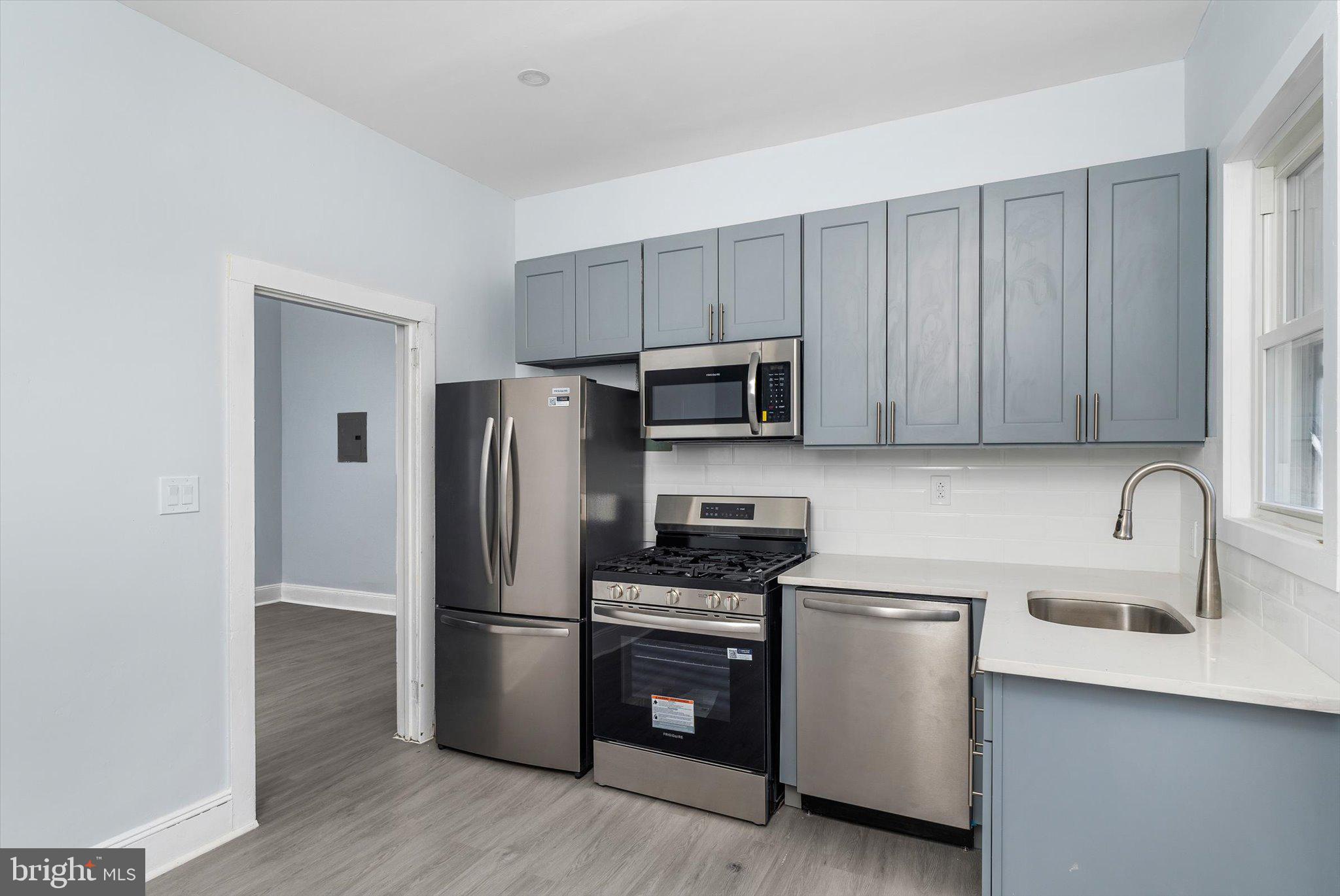 10 Lytle Street, Unit 2 Princeton, NJ 08542 - Photo 13 of 16 a kitchen with stainless steel appliances a refrigerator stove and sink