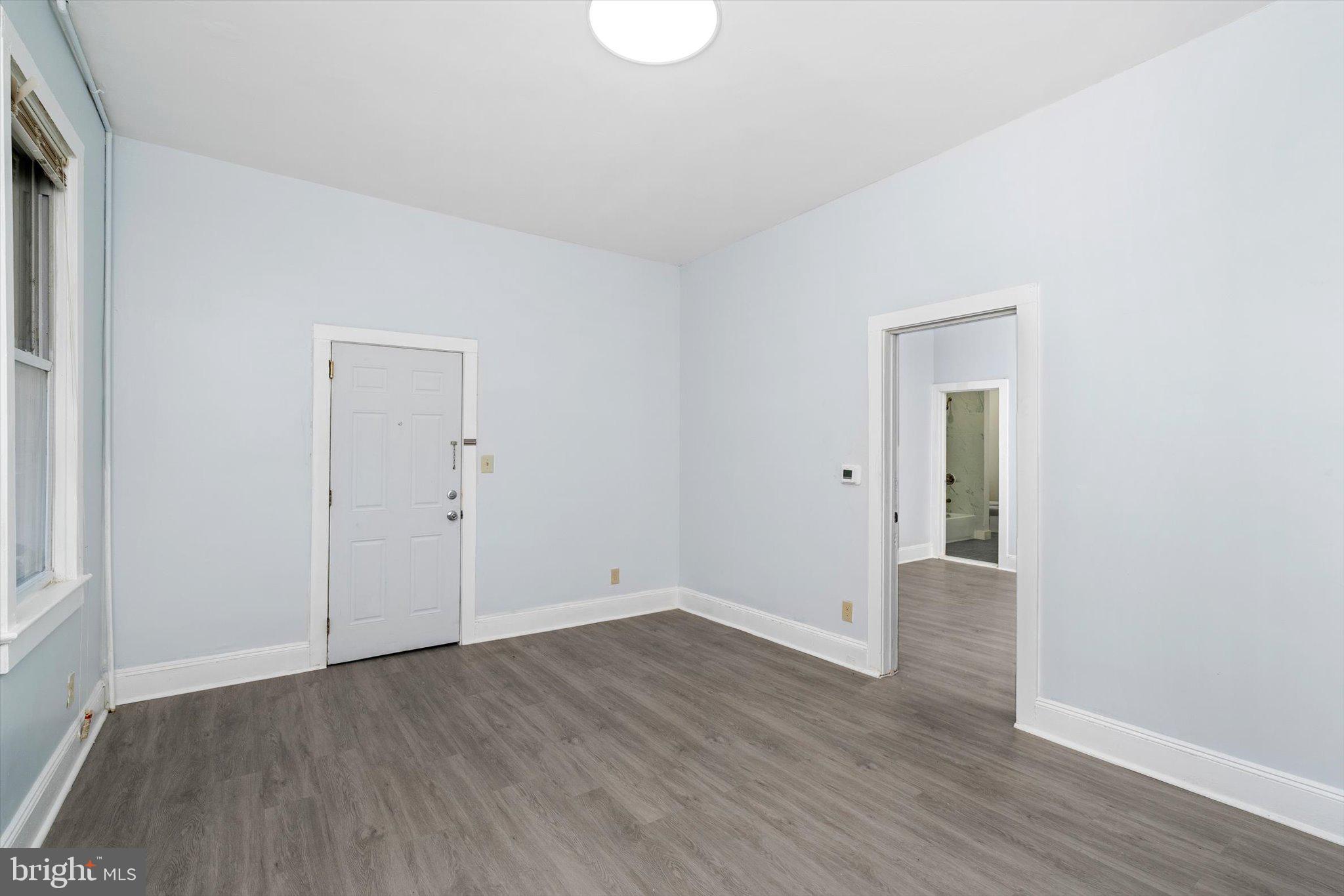 10 Lytle Street, Unit 2 Princeton, NJ 08542 - Photo 7 of 16 an empty room with wooden floor and windows