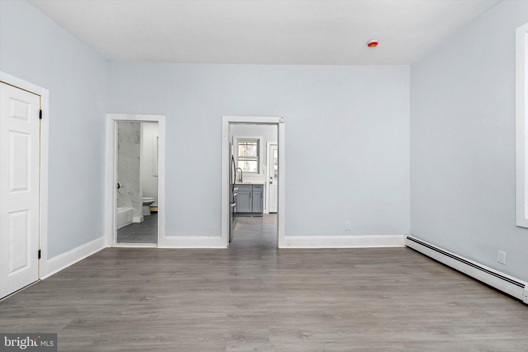 10 Lytle Street, Unit 2 Princeton, NJ 08542 - Photo 8 of 16 a view of an empty room with wooden floor and closet
