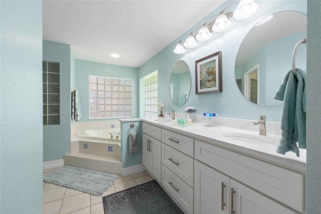 18825 Southwest 93rd Loop Dunnellon, FL 34432 - Photo 42 of 85 a spacious bathroom with a granite countertop sink mirror and