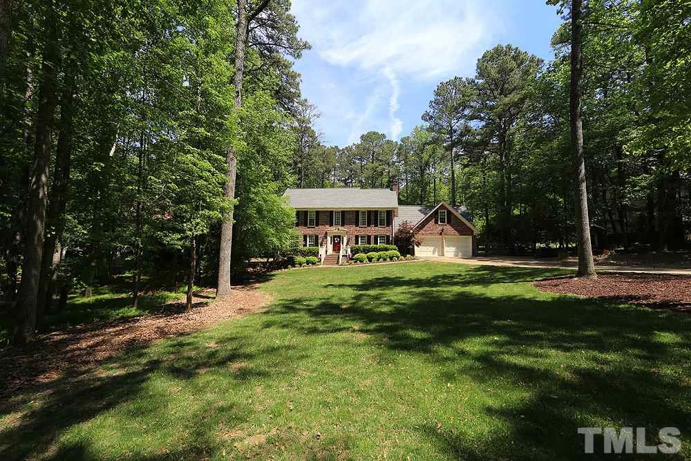 716 Bennington Drive Raleigh, NC 27615 - Photo 2 of 29 a front view of a house with a yard and trees